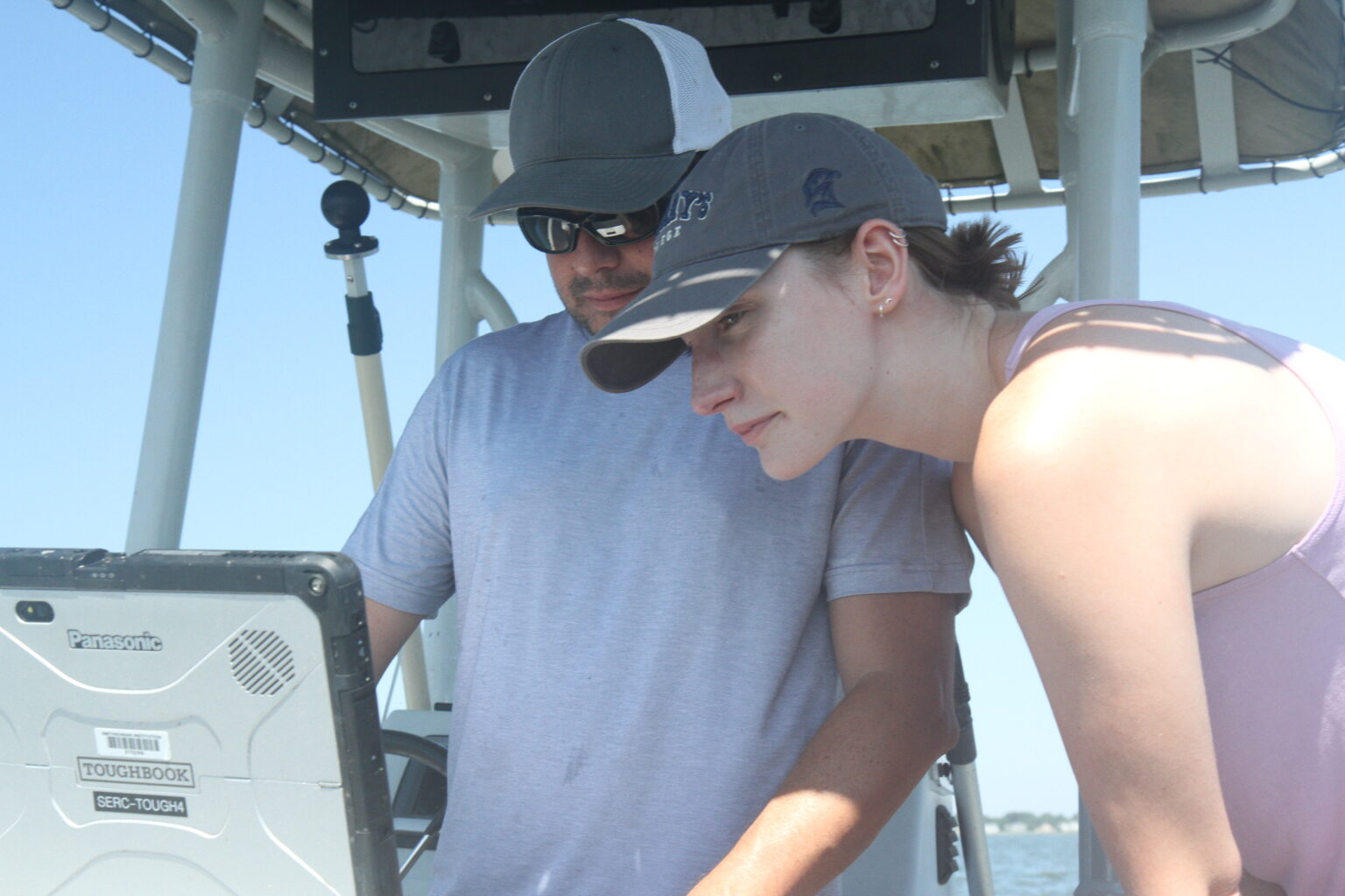 Researchers record sonar video from a boat on Harris Creek.